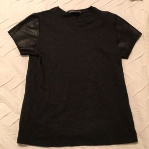 Black T-shirt with faux leather sleeves
